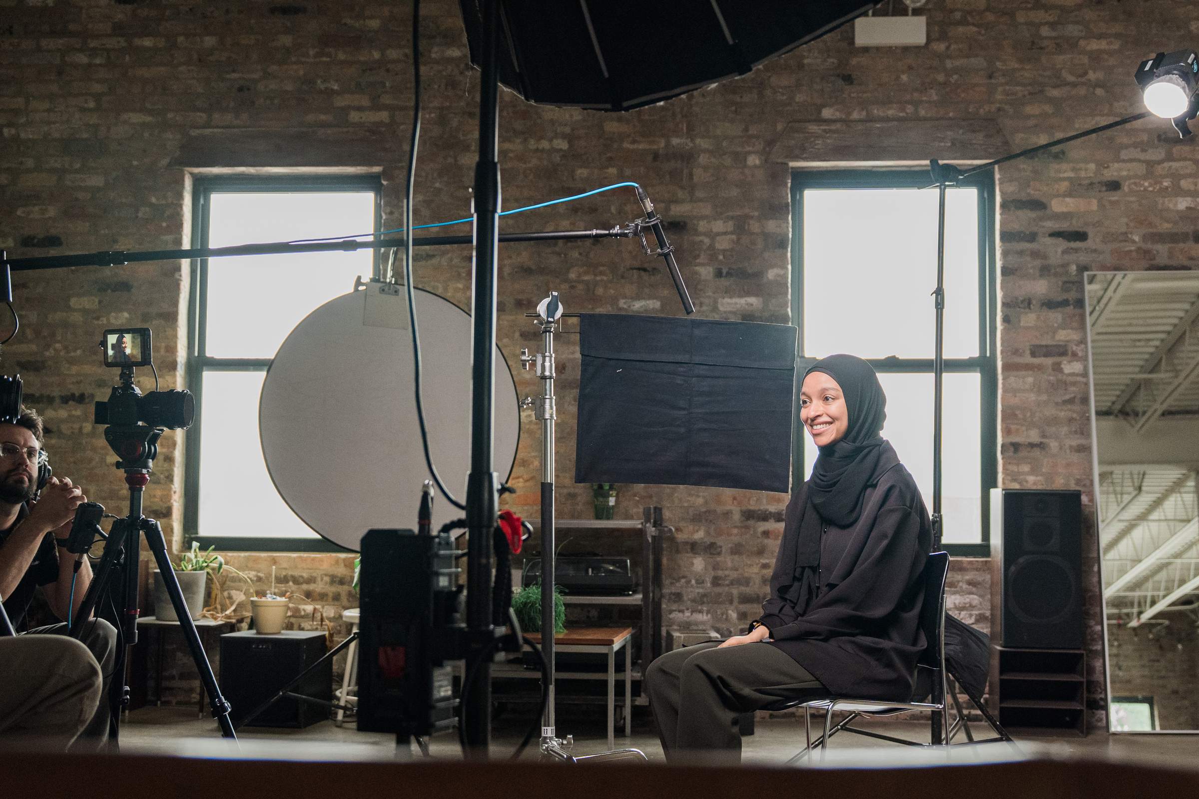 Woman smiling during a documentary interview filmed by the Storyteller Studios crew.