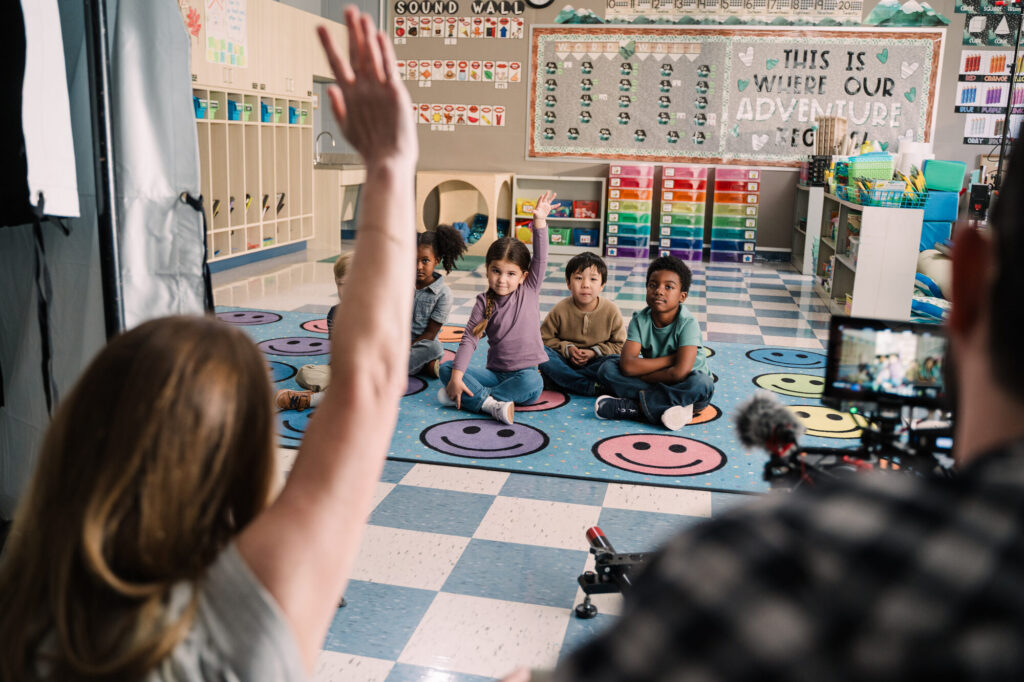 Storyteller Studios crew films the classroom scene of the IDPH newborn hearing screening PSA with child actors on set in Springfield