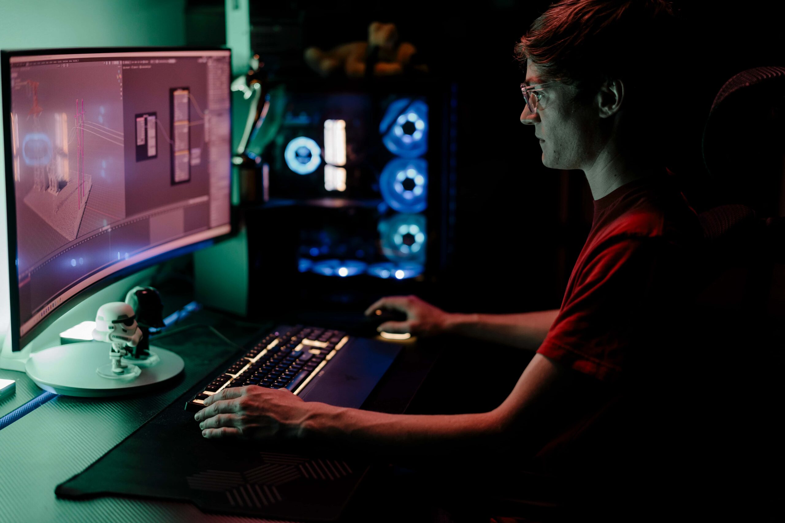 storyteller studios 3d animator eli ommen edits a projet on cooly-lit monitors in his edit suite